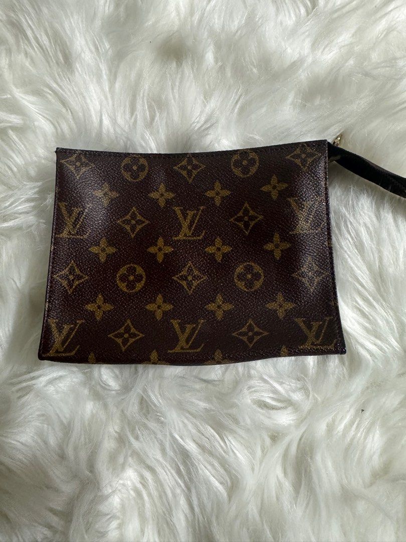 Louis Vuitton Monogram Pouch (Category: Luxury Bags & Wallets) located in Quezon City. Submitted by jbspreloved (Listing ID 1415388457, Image 1). Description: - Authentic Louis Vuitton Toiletry 19 - Classic Monogram canvas - NO cracks - No damage on the canvas - tarnished puller - darkened leather tab with scuff .