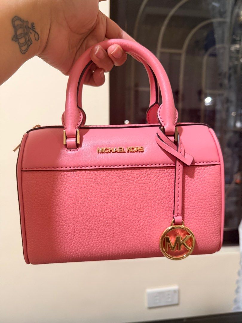 Michael Kors Mini Duffle (Category: Luxury Bags & Wallets) located in Manila. Submitted by authenticprelovedmnls (Listing ID 1415368559, Image 1). Description: Once used lang. Then display na. Orig 100% with tag Teal rose color🧡.