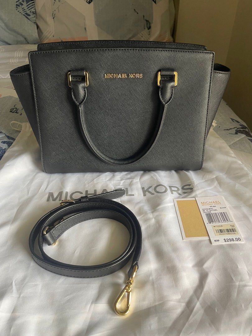 MICHAEL KORS Selma medium bag (Category: Luxury Bags & Wallets) located in Mandaluyong City. Submitted by fabfindsmnl (Listing ID 1415356253, Image 1). Description: 💯 authentic Michael Kors Selma medium satchel. Personally bought in Macy’s US for 298 USD (15k pesos). Complete with strap and dustbag. Dimensions: 14” L X 8.5” H X 5”W Gold hardware has some tarnishings and minor signs of use but leather of the bag is pristine and in excellent condi