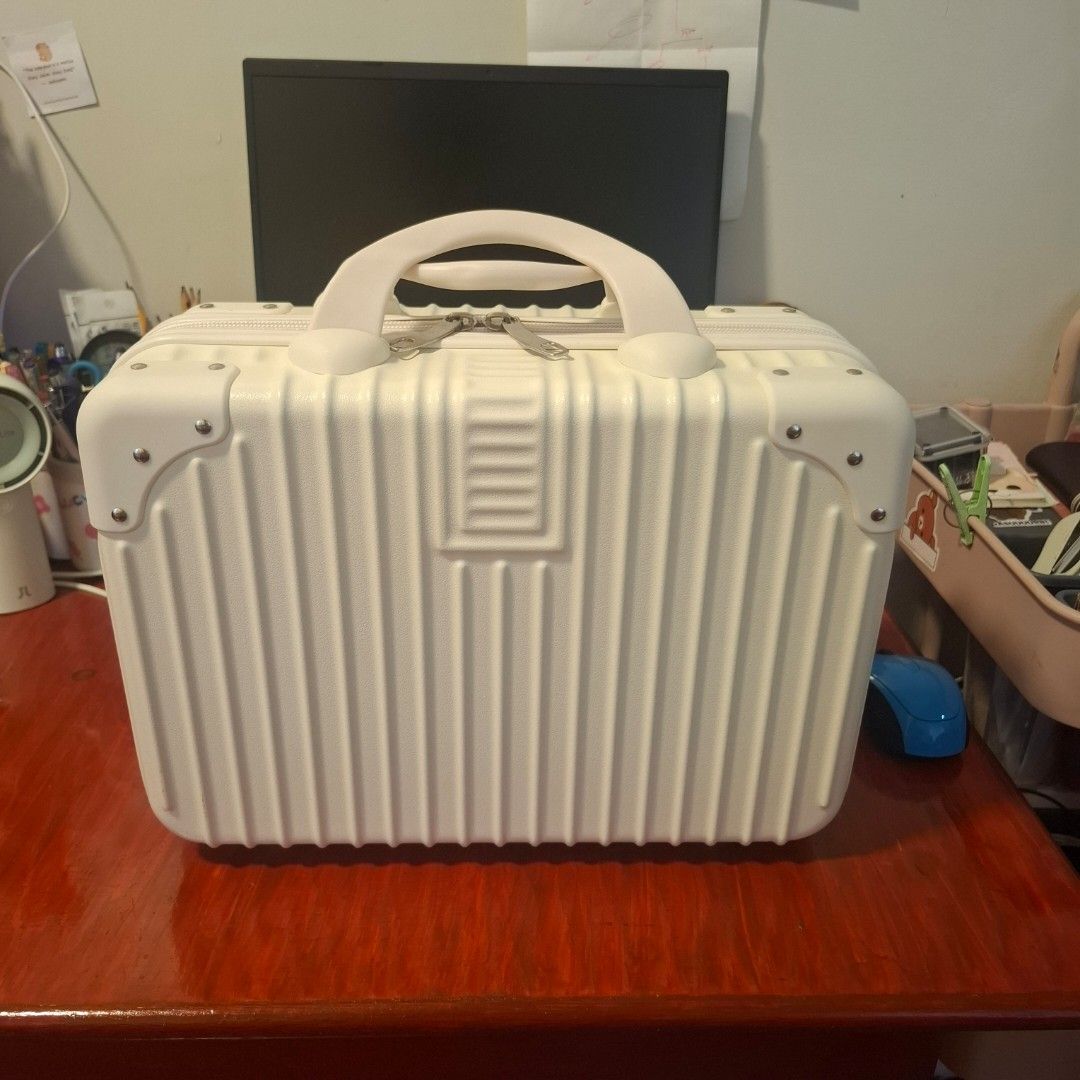 Mini Luggage or Cosmetic Bag (Category: Purses & Pouches) located in Cavite. Submitted by Kal_07 (Listing ID 1415251498, Image 2). Description: Hello! Welcome to our Shop! Got this as a gift around last 2024. Never been used just stored. Also, there's a bit like scratch or flaw, but its small, not much seen. RFS: Don't know where to used 😅 Courier: Lalamove, JNT, Gogoexpress, LBC (Open for COD) also, (if you have other couriers that can deliver 