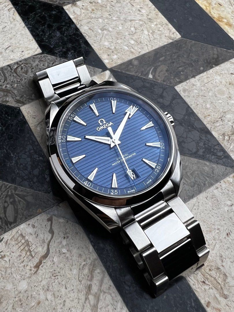 Omega Seamaster Aquaterra (Category: Men's Watches) located in Manila. Submitted by mnlwatchsociety (Listing ID 1415320905, Image 2). Description: One of those dials collectors never get tired of. The blue teak pattern plays with light—moving between navy and blue-teal—adding depth without excess. Balanced proportions, a timeless colorway, and a design that ages gracefully. This is the Aqua Terra at its most complete. Omega Seamaster Aqua Terra R