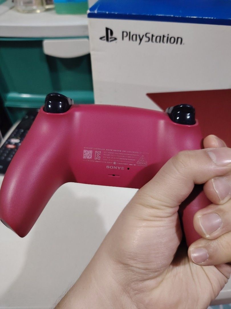 PlayStation 5 DualSense Controller - Red (Category: Controllers) located in Manila. Submitted by lemsgadgetszone (Listing ID 1415380782, Image 2). Description: - Red PlayStation 5 DualSense controller - Standard button layout and design - Features a built-in touchpad - Includes the PlayStation logo - Box is visible.