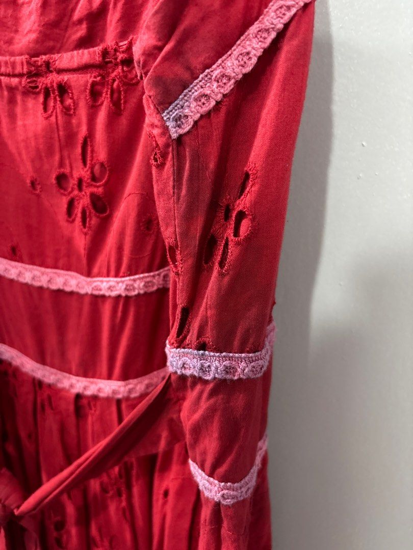 Red Eyelet Dress with Tie Back (Category: Dresses) located in Manila. Submitted by rjules_ (Listing ID 1415416904, Image 3). Description: - Red floral eyelet dress - Features delicate lace trim - Cotton fabric - Flared skirt design - Issues: Faint Blue Stains in spots (Nahawa siya from another clothing item 😔 but its not obvious naman!!) Measurements: Full Strap Length: 15 inches (So around 7.5 inches) Bust/Chest Width: 15 inches Length (From Ne