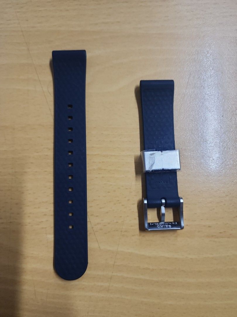 Seiko Rubber Watch Strap (Category: Men's Watches) located in Taguig. Submitted by masterbert (Listing ID 1415276012, Image 2). Description: Genuine Seiko rubber watch strap from seiko baby tuna srph77 save the ocean. Features a navy blue color with a stainless steel buckle. The strap has a textured surface. Includes the Seiko logo on the buckle..