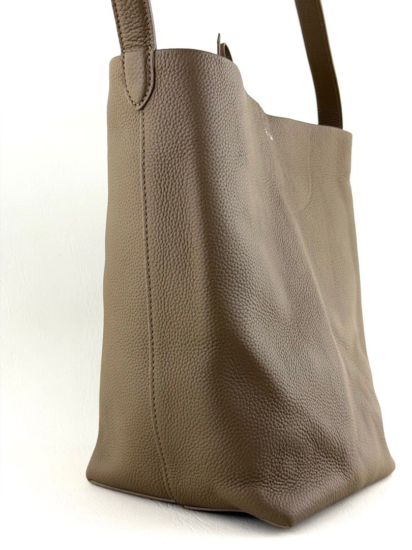 THE ROW N/S Park Medium Tote Bag (Category: Luxury Bags & Wallets) located in Manila. Submitted by luvluxe.mnl (Listing ID 1415262213, Image 3). Description: Medium size- can fit a lot So chic& elegant!!! In taupe color SRP is 95k+ on online websites.