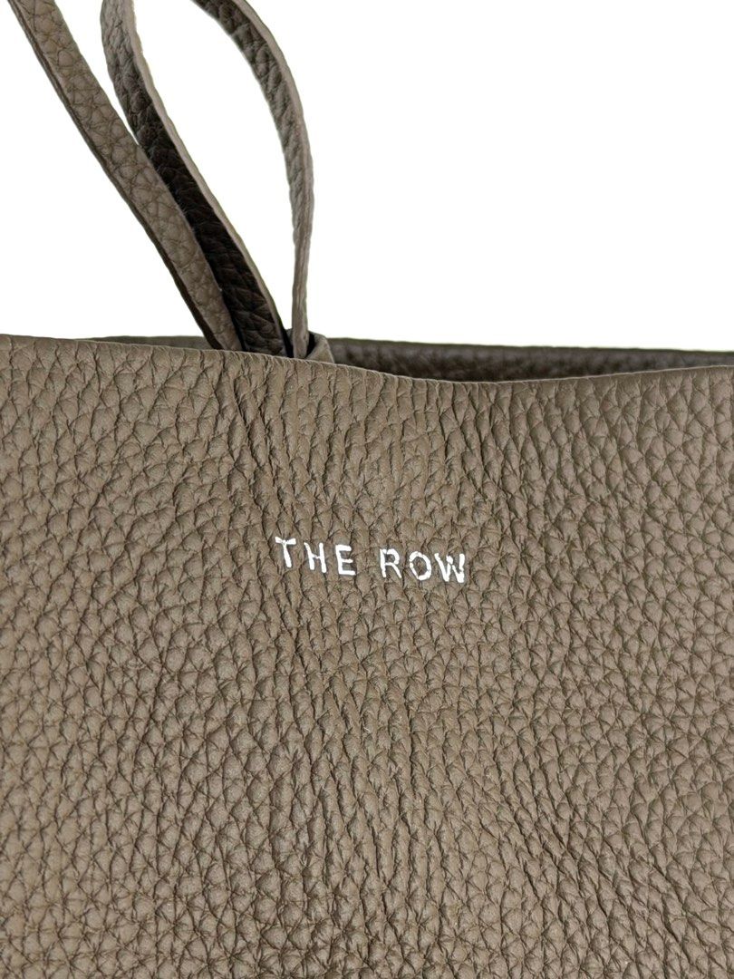 THE ROW N/S Park Medium Tote Bag (Category: Luxury Bags & Wallets) located in Manila. Submitted by luvluxe.mnl (Listing ID 1415262213, Image 2). Description: Medium size- can fit a lot So chic& elegant!!! In taupe color SRP is 95k+ on online websites.