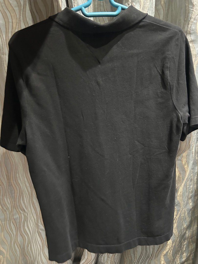 Tommy Hilfiger Black Polo Shirt - Medium (Category: Shirts) located in Manila. Submitted by lrocamora (Listing ID 1415401656, Image 3). Description: - Tommy Hilfiger black polo shirt - Size: Medium - Features the iconic Tommy Hilfiger logo - Regular fit - Classic design - Short sleeves - Three-button placket - Collar with Tommy Hilfiger stripe detail.