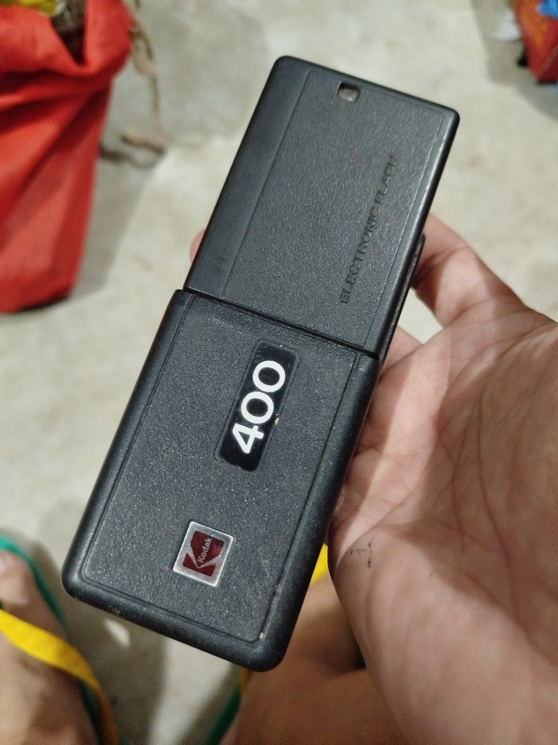 Vintage Kodak Ektralite 400 Camera (Category: Cameras) located in Subic. Submitted by regiedaniel01 (Listing ID 1415337860, Image 2). Description: - Kodak Ektralite 400 camera - Built-in electronic flash - Easy to use with an orange button - Flash switch for control - Distinctive '400' model number - Features the classic Kodak logo not working.