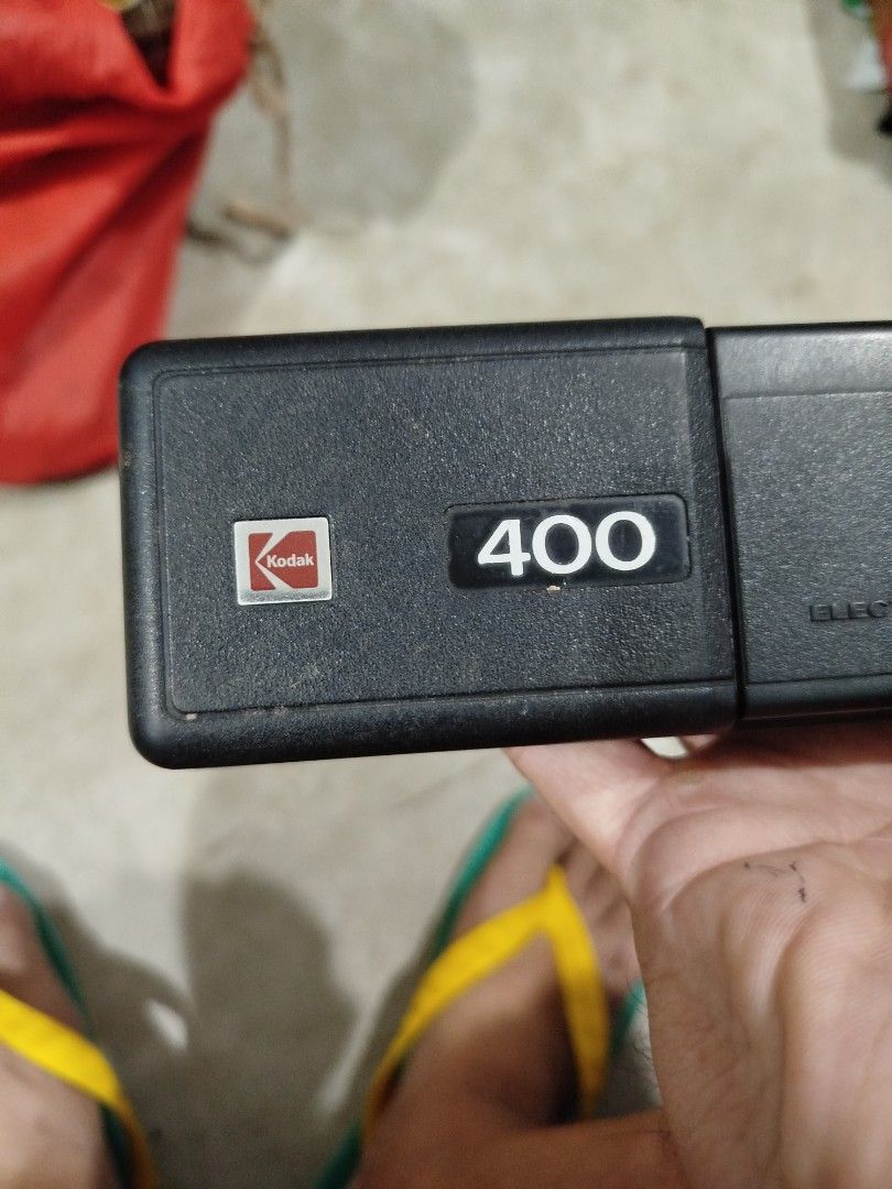 Vintage Kodak Ektralite 400 Camera (Category: Cameras) located in Subic. Submitted by regiedaniel01 (Listing ID 1415337860, Image 3). Description: - Kodak Ektralite 400 camera - Built-in electronic flash - Easy to use with an orange button - Flash switch for control - Distinctive '400' model number - Features the classic Kodak logo not working.