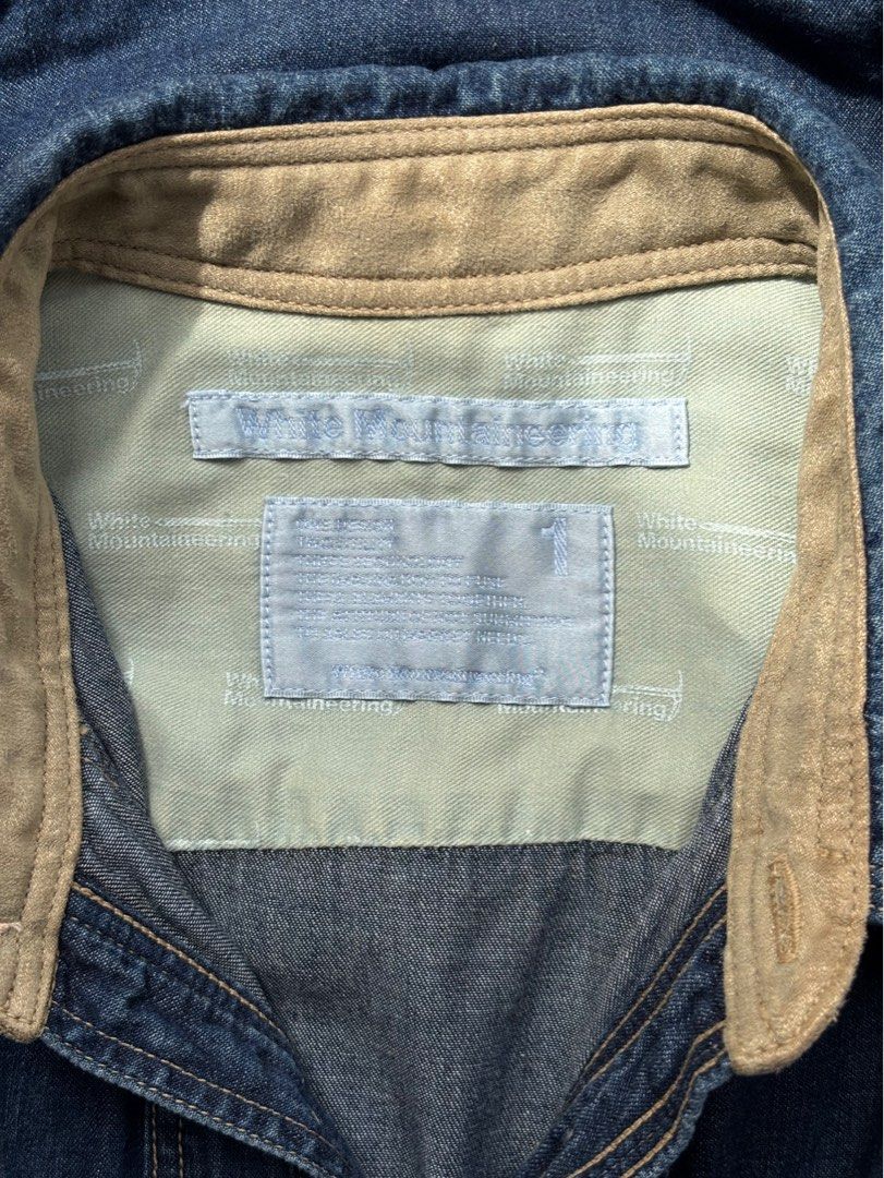 White Mountaineering Suede Panel Denim Shirt (Category: Tshirts & Polo Shirts ) located in Paranaque City. Submitted by grailonious (Listing ID 1415364603, Image 2). Description: - White Mountaineering Denim Shirt - Features suede panel detailing - Size 1 or S. See the pictures for measurements in cm - no issues.