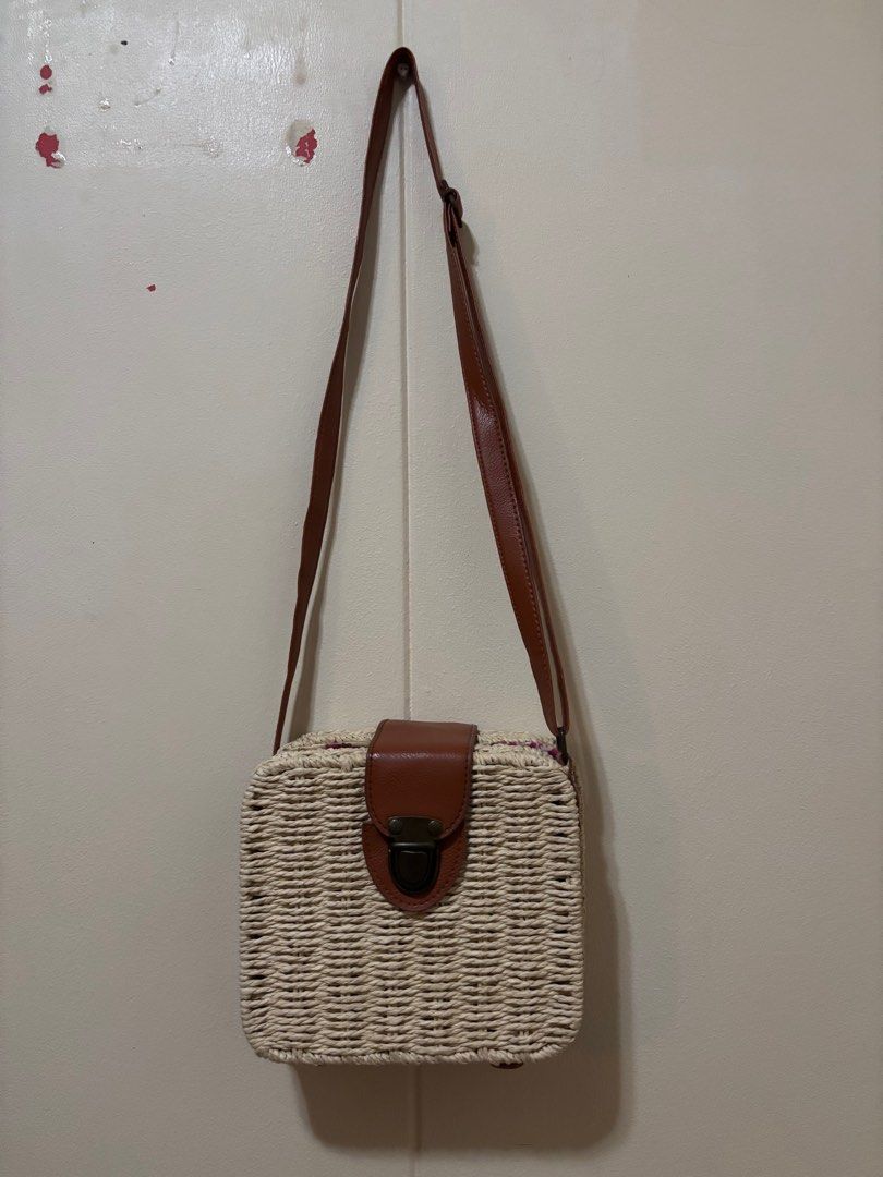Woven Crossbody Bag with Brown Strap (Category: Cross-body Bags) located in Las Pinas. Submitted by tidyspaces (Listing ID 1415293071, Image 1). Description: Good for the beach Rattan type bag Never used.