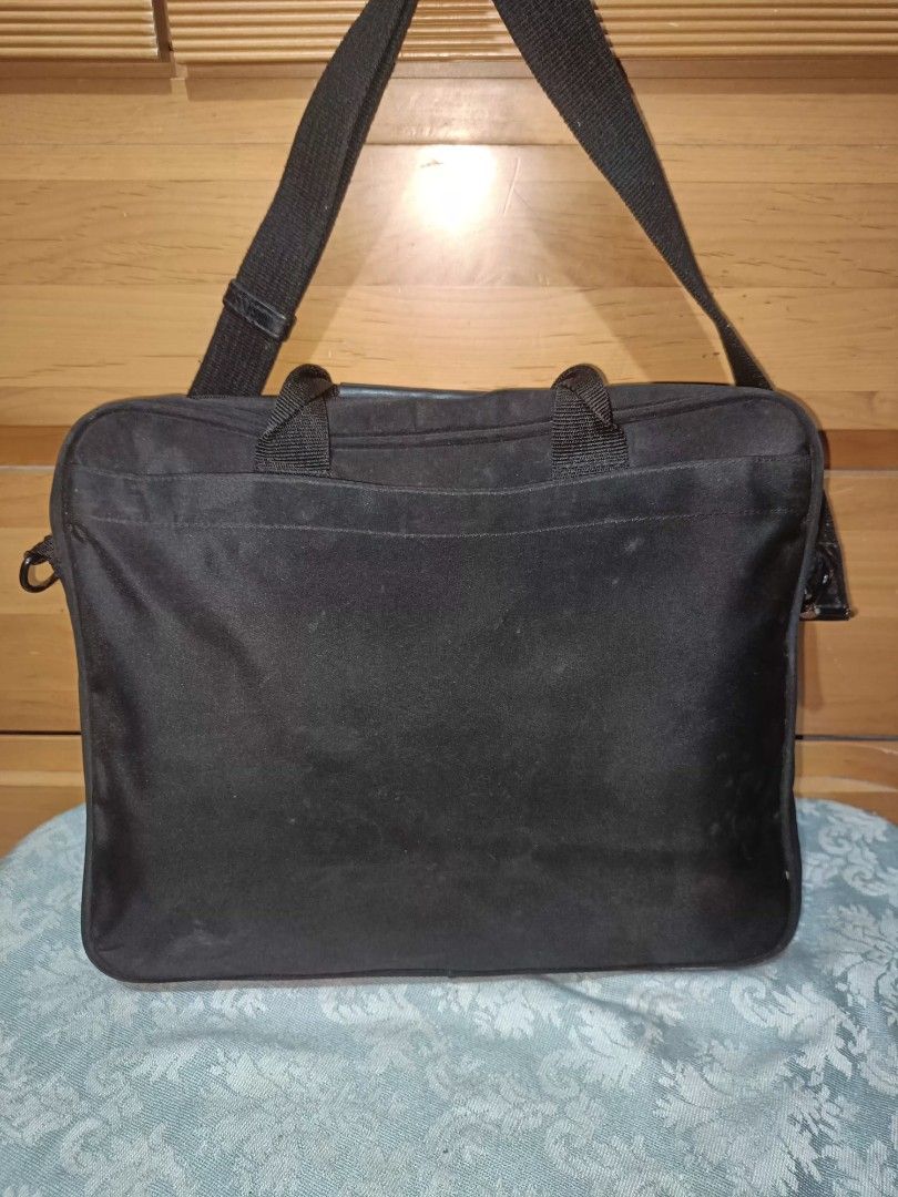 Acer Laptop Bag with Shoulder Strap (Category: Laptop Bags & Sleeves) located in Baguio. Submitted by iyaberong48242 (Listing ID 1415469536, Image 2). Description: Black Acer laptop bag with a shoulder strap and a handle. It has a front pocket with the Acer logo. The bag has a main compartment and a side pocket. The bag measures approximately 14 inches in height and 13 inches in width. The depth is about 2 inches. The interior is black with Acer 