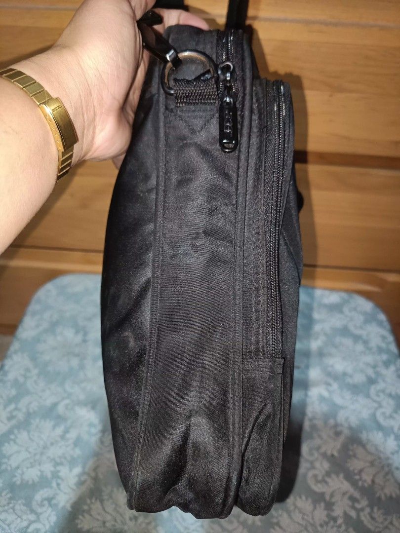 Acer Laptop Bag with Shoulder Strap (Category: Laptop Bags & Sleeves) located in Baguio. Submitted by iyaberong48242 (Listing ID 1415469536, Image 3). Description: Black Acer laptop bag with a shoulder strap and a handle. It has a front pocket with the Acer logo. The bag has a main compartment and a side pocket. The bag measures approximately 14 inches in height and 13 inches in width. The depth is about 2 inches. The interior is black with Acer 