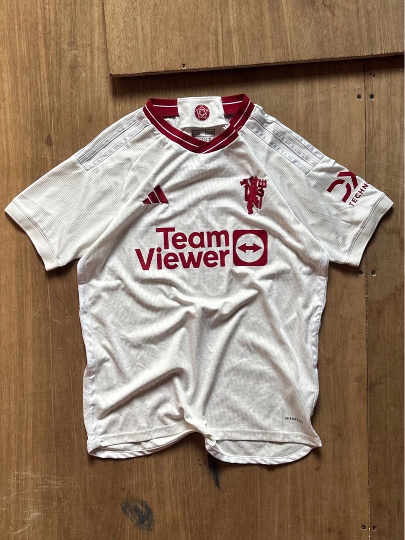 Adidas Manchester United Jersey (Category: Activewear) located in Caloocan City. Submitted by keepinhighl (Listing ID 1415604502, Image 1). Description: - Official Adidas Manchester United away jersey - Features TeamViewer sponsor logo and club crest - White base with maroon accents - Slim fit, size S - Made in Thailand.