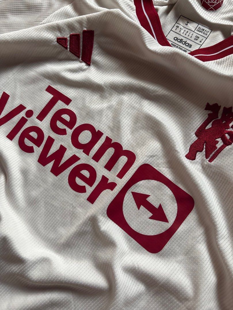 Adidas Manchester United Jersey (Category: Activewear) located in Caloocan City. Submitted by keepinhighl (Listing ID 1415604502, Image 3). Description: - Official Adidas Manchester United away jersey - Features TeamViewer sponsor logo and club crest - White base with maroon accents - Slim fit, size S - Made in Thailand.