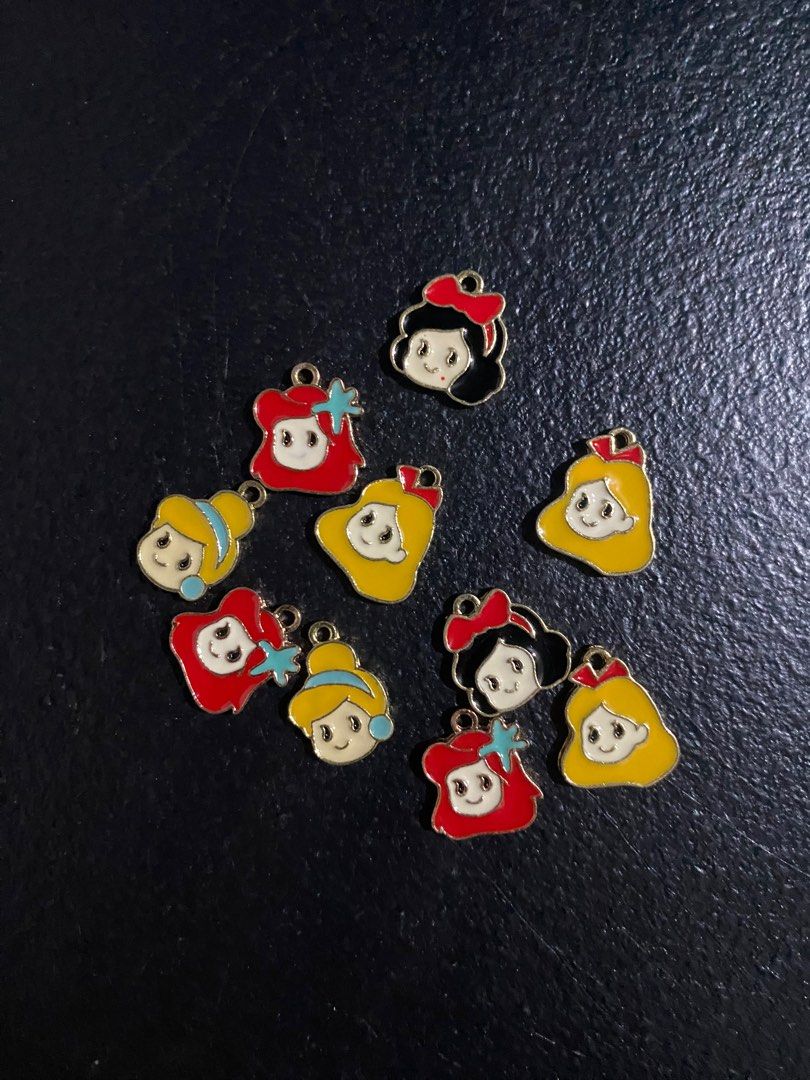 Cute Charms for Jewelry Making (Category: Charms) located in Valenzuela. Submitted by emg.everythingmustgo (Listing ID 1415571100, Image 2). Description: 100 each pouch 1,000 take all Collection of assorted charms perfect for jewelry making. Includes various designs such as princess faces, cupcakes, Totoro, planets, clovers, butterflies, paw prints, and more. These charms are ideal for creating unique earrings, necklaces, bracelets, or other pers