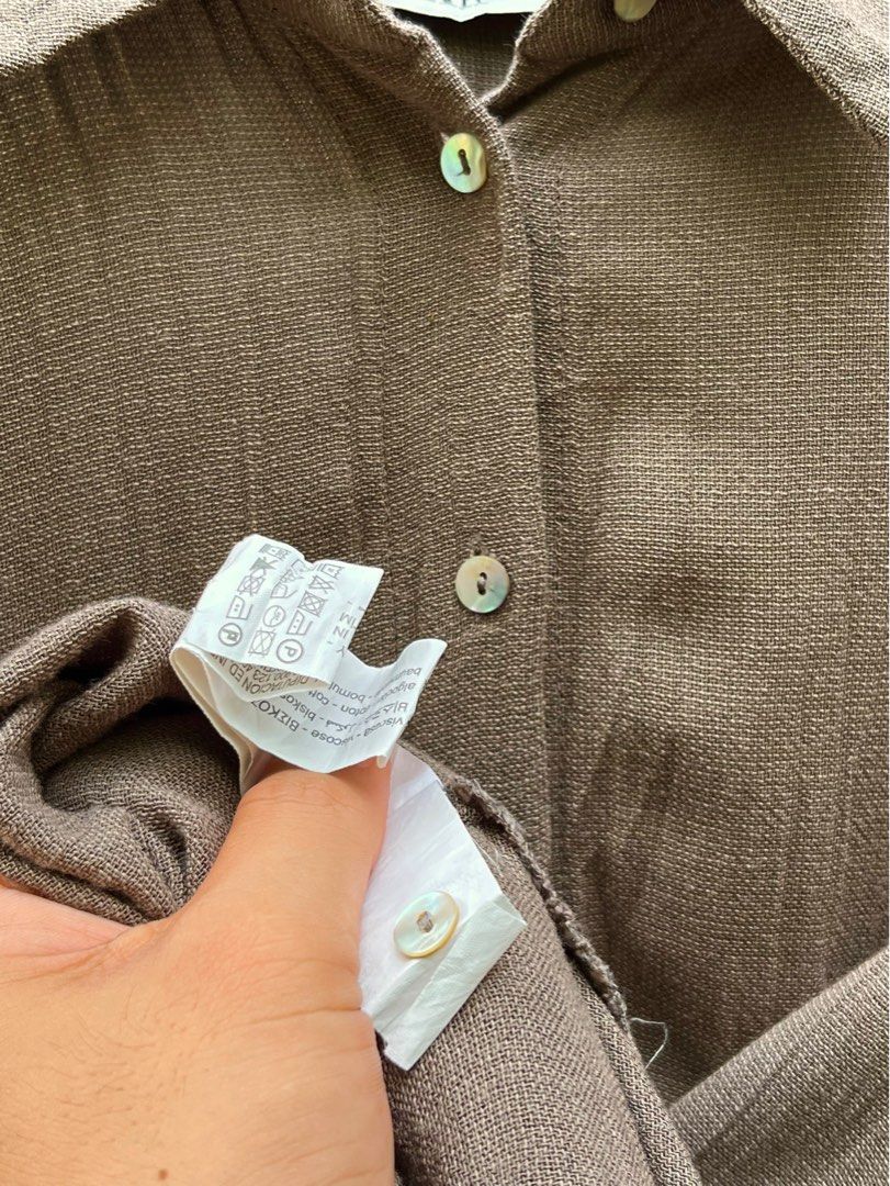 Authentic ZARA Collared Button-down Polo Mocha / Choco Brown Dress size Medium-Large (Category: Others Tops) located in Maasin. Submitted by ndifferance (Listing ID 1415447950, Image 3). Description: Bought at ₱2,595 at Zara store in Ayala Mall years ago. Only used twice with care. RFS: Has been closet for years so need to declutter for spaces. 📌Size Medium on tag but still fit for Large sizes 📌Dimes: Length 36 inches Width 24 inches color rate