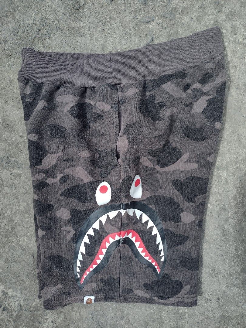 BAPE Shark Camo Shorts XL (Category: Shorts) located in Quezon City. Submitted by keepthrift15 (Listing ID 1415519145, Image 2). Description: - Off BAPE Shark Face Shorts - Gray Camouflage Pattern - Size: XL - Material: 100% Cotton - Features: Elastic Waistband & Drawstring - Includes BAPE Logo.
