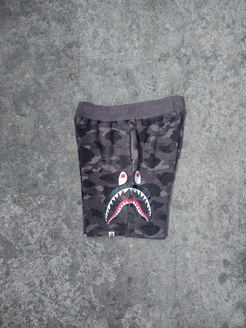 BAPE Shark Camo Shorts XL (Category: Shorts) located in Quezon City. Submitted by keepthrift15 (Listing ID 1415519145, Image 1). Description: - Off BAPE Shark Face Shorts - Gray Camouflage Pattern - Size: XL - Material: 100% Cotton - Features: Elastic Waistband & Drawstring - Includes BAPE Logo.