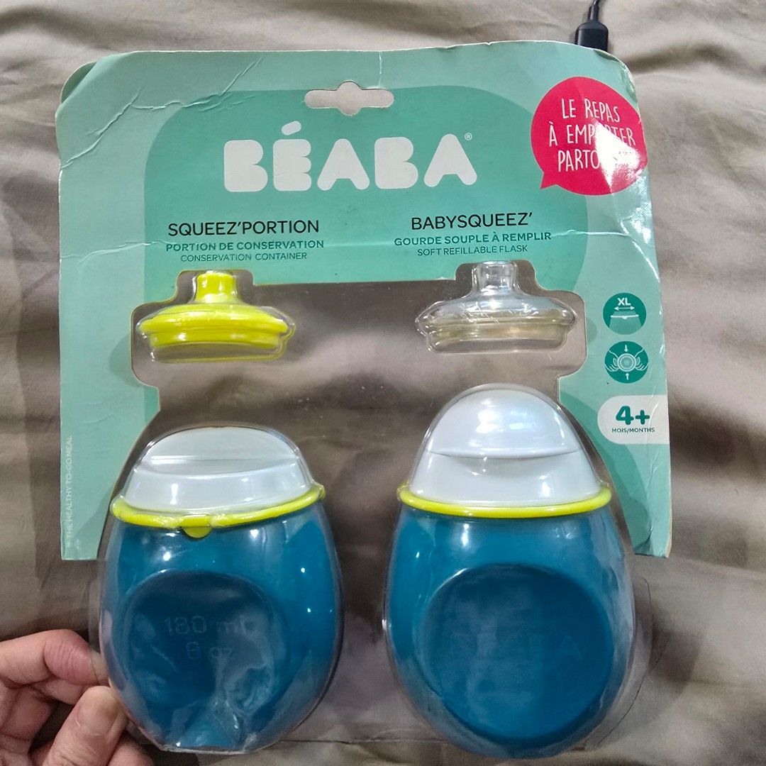 Beaba Babysqueeze Portion Container (Category: Weaning & Toddler Feeding) located in Manila. Submitted by cat.dee (Listing ID 1415518650, Image 1). Description: Beaba GREAT FOR BABIES AND TODDLERS: Comes with a 1st stage (6-12 months) supple spout or 2nd stage (12+ months) harder spout for easy transition. REUSABLE AND VERSATILE: Wide opening allows for pouch to be used as a jar. Holds everything from purees to yogurts. DESIGN: Stable base allows