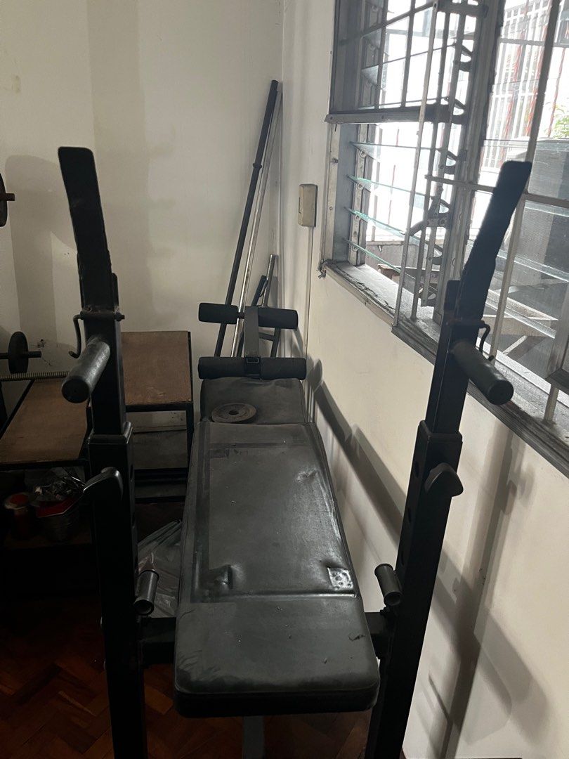 Bench press (Category: Weights & Dumbbells) located in Quezon City. Submitted by roejogan (Listing ID 1415485437, Image 2). Description: Bench press -can incline -includes leg extension attachment -includes 2 steel bars -includes 2 10 lbs plates.