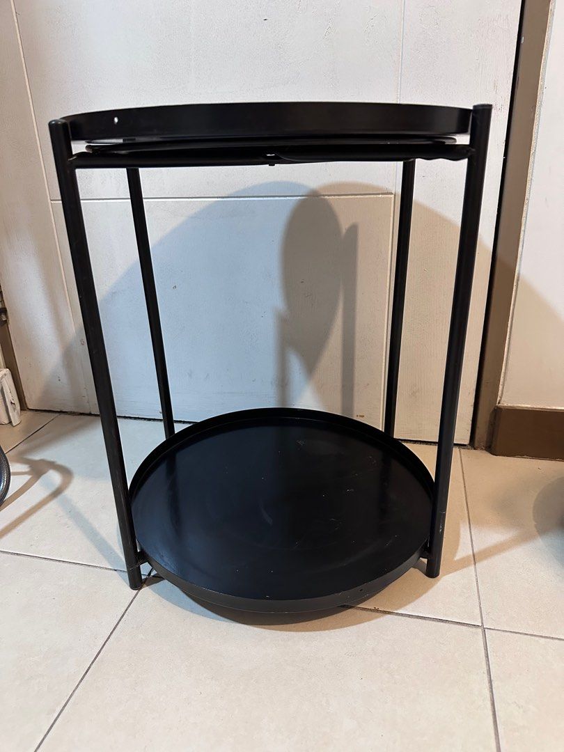 Black Metal Round Side Table 2-layer (Category: Tables & Sets) located in Taguig. Submitted by lifestyledeclutter (Listing ID 1415542789, Image 3). Description: - Black metal side table - Round top - Lower shelf for storage - Sturdy frame - Minimalist design - Ideal for drinks, books, or decor - Versatile for any living space.