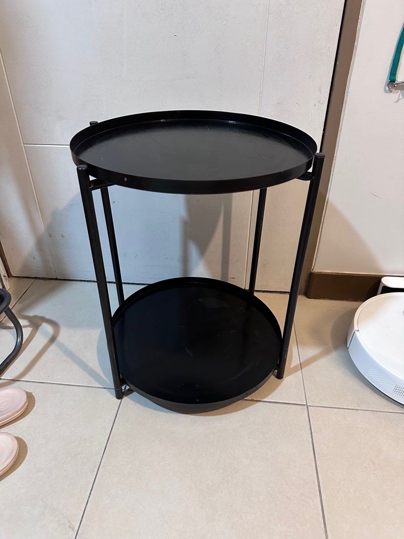 Black Metal Round Side Table 2-layer (Category: Tables & Sets) located in Taguig. Submitted by lifestyledeclutter (Listing ID 1415542789, Image 2). Description: - Black metal side table - Round top - Lower shelf for storage - Sturdy frame - Minimalist design - Ideal for drinks, books, or decor - Versatile for any living space.