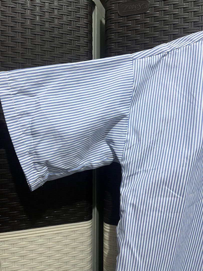 Blue and White Striped Button-Down Shirt (Category: Shirts) located in Paranaque City. Submitted by rieclutter (Listing ID 1415542916, Image 2). Description: - Can fit s-m - Blue and white striped button-down shirt - Collared neckline - Short sleeves - Single chest pocket - Relaxed fit - Button-up closure.