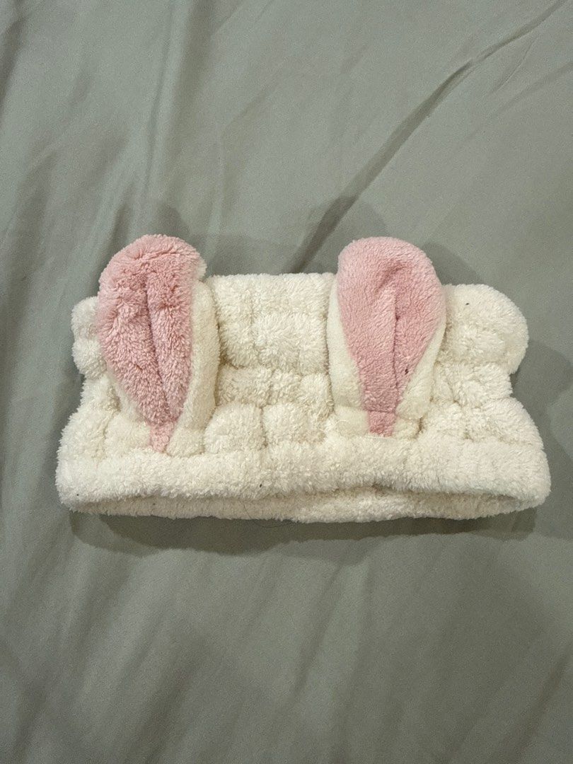 Bunny Ear Headband (Category: Hair Accessories) located in Famy. Submitted by purplegs (Listing ID 1415487328, Image 1). Description: - Adorable bunny ear headband - Soft and fluffy material - Light pink bunny ears - Comfortable fit - Keeps hair out of your face - Ideal for washing face or applying makeup - Adds a fun touch to your routine.