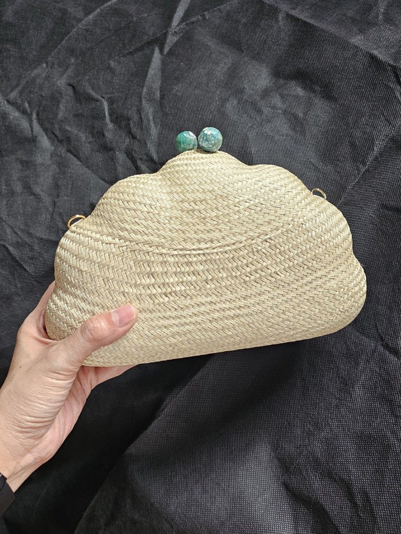 Shell-Shaped Woven Clutch with Turquoise Detail (Category: Clutches) located in Quezon City. Submitted by ilovenystuff (Listing ID 1415477992, Image 3). Description: - shell-shaped clutch bag -Buntal Woven texture - Light beige color / natural - Turquoise embellishments on clasp - Gold-colored loops for strap attachment - Suitable for various occasions - gold chain.