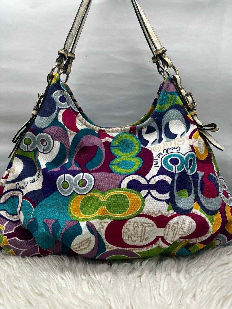 Coach Multicolor Shoulder Bag (Category: Luxury Bags & Wallets) located in Cainta. Submitted by cherie0831 (Listing ID 1415539562, Image 1). Description: - Authentic Coach shoulder bag - Eye-catching multicolor pattern - Roomy interior - Elegant white leather straps - Convenient interior pocket .