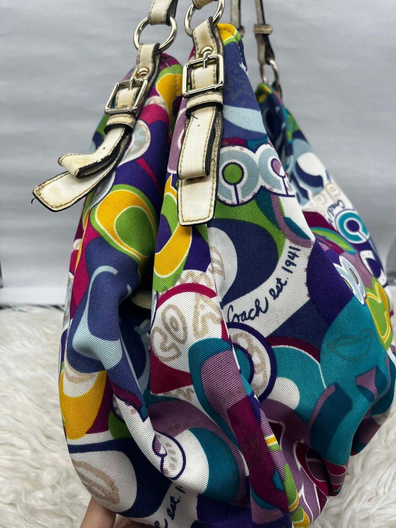 Coach Multicolor Shoulder Bag (Category: Luxury Bags & Wallets) located in Cainta. Submitted by cherie0831 (Listing ID 1415539562, Image 3). Description: - Authentic Coach shoulder bag - Eye-catching multicolor pattern - Roomy interior - Elegant white leather straps - Convenient interior pocket .