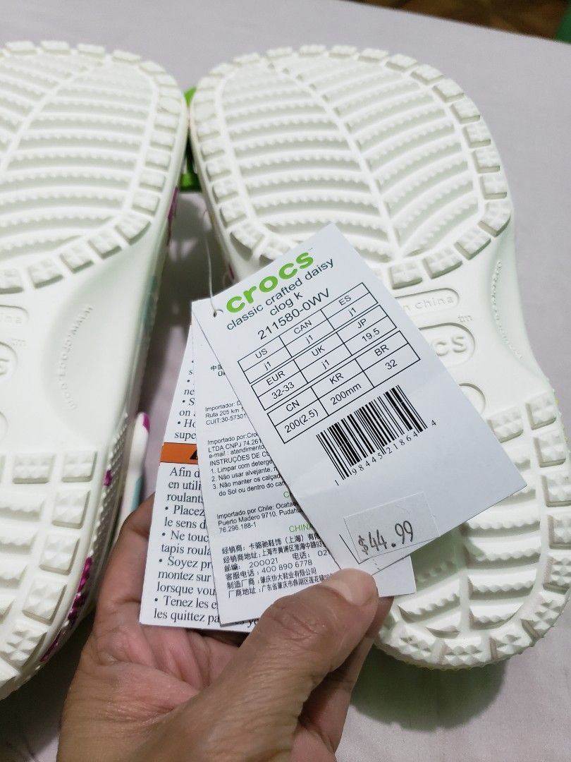 Crocs Classic Crafted Daisy Clogs (Category: Babies & Kids Fashion) located in Manila. Submitted by feg39 (Listing ID 1415524982, Image 3). Description: - Authentic Crocs Classic Crafted Daisy clogs - White base with colorful daisy pattern - Size: J1 (fits US women's size 3, EU 32-33, 19.5 cm) - Includes original tags - Made in China.
