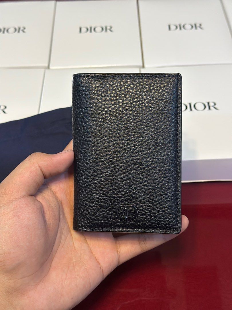 Dior Black Leather Card Holder (Category: Luxury Bags & Wallets) located in Caloocan City. Submitted by nhazzzz (Listing ID 1415609764, Image 2). Description: - Authentic Dior card holder - Black leather with textured finish - Features the iconic CD logo - Includes dust bag and authenticity card - Made in Spain - Multiple card slots - Black leather interior.