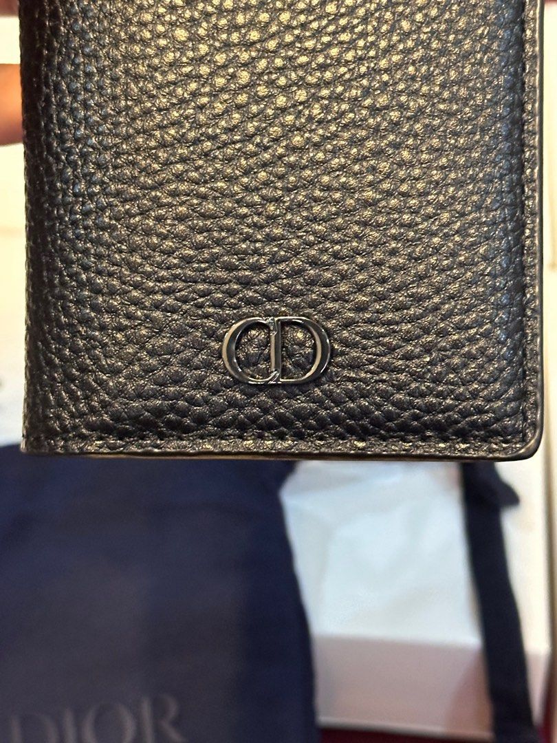Dior Black Leather Card Holder (Category: Luxury Bags & Wallets) located in Caloocan City. Submitted by nhazzzz (Listing ID 1415609764, Image 3). Description: - Authentic Dior card holder - Black leather with textured finish - Features the iconic CD logo - Includes dust bag and authenticity card - Made in Spain - Multiple card slots - Black leather interior.