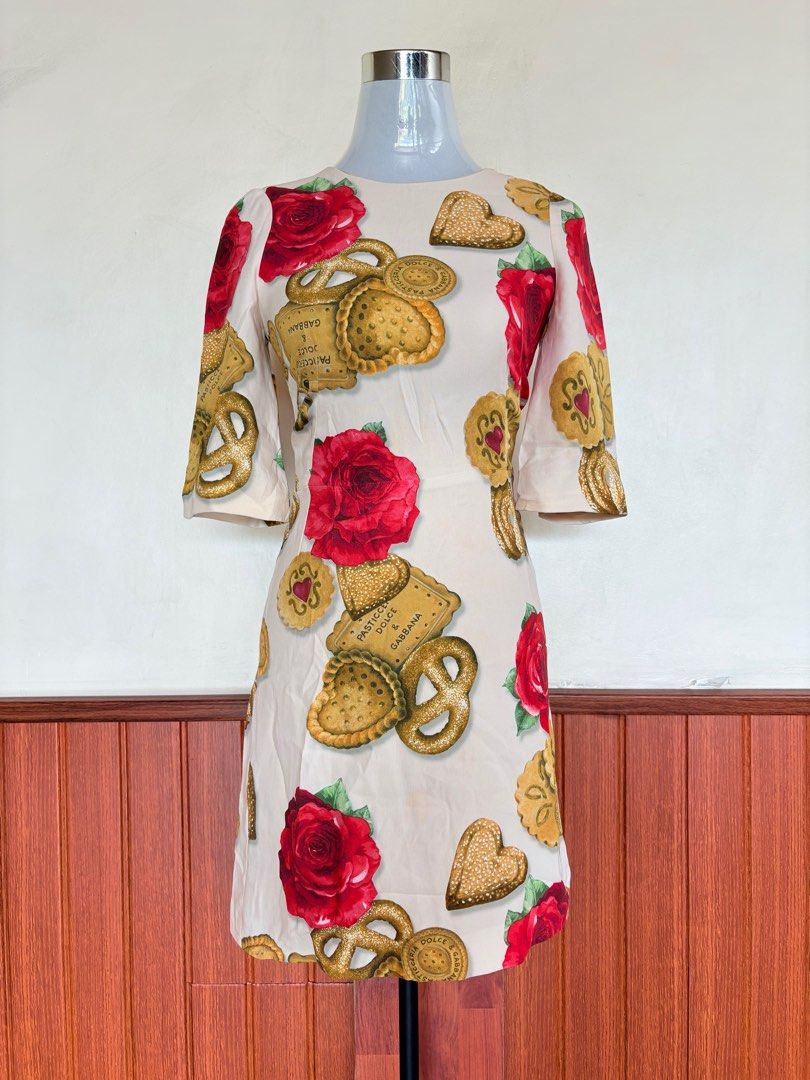Dolce Gabbana Cookie Biscoff Printed Dress (Category: Luxury Apparel) located in Cebu City. Submitted by stylingtrends.coll (Listing ID 1415478733, Image 1). Description: - Unique cookie and rose print - Tailored fit - Short sleeves - Flattering silhouette - Size 38 Medium - Back zipper closure.