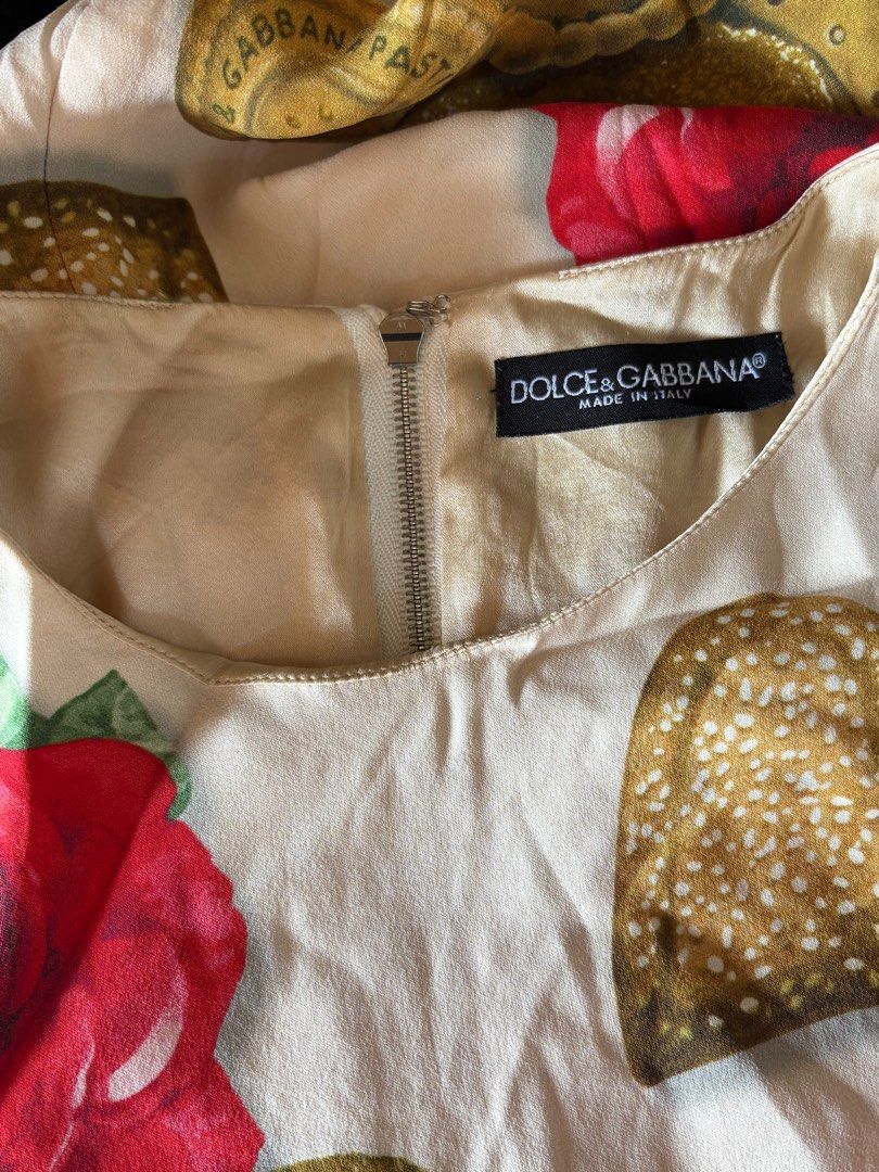 Dolce Gabbana Cookie Biscoff Printed Dress (Category: Luxury Apparel) located in Cebu City. Submitted by stylingtrends.coll (Listing ID 1415478733, Image 3). Description: - Unique cookie and rose print - Tailored fit - Short sleeves - Flattering silhouette - Size 38 Medium - Back zipper closure.