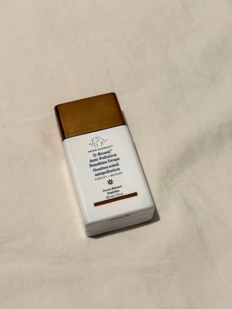 Drunk Elephant D-Bronzi 30ML (Category: Makeup) located in Manila. Submitted by kylieolarte (Listing ID 1415600536, Image 1). Description: SRP Php 2,600 selling it for Php 1.2k 80% left, almost new! Got this in thailand sephora, 100% authentic The Drunk Elephant D-Bronzi™ Anti-Pollution Sunshine Drops are a serum designed to give skin a warm, bronzy look while also providing skincare benefits.