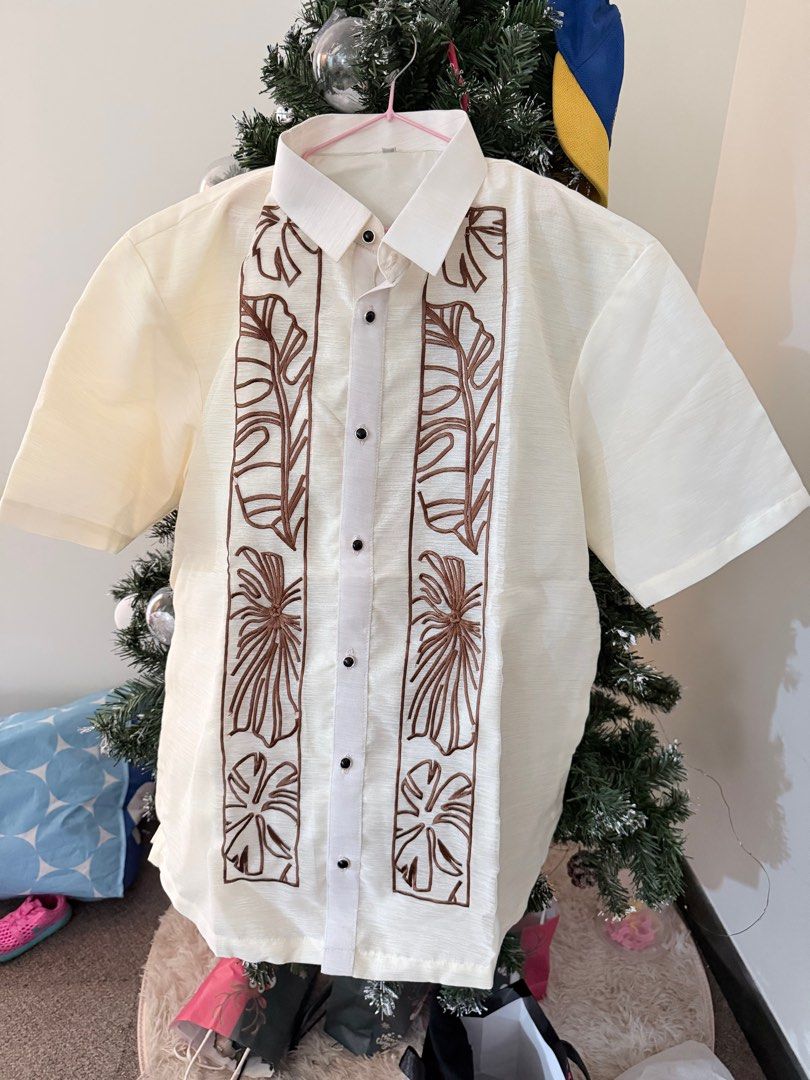 Embroidered Barong Tagalog (Category: Formal Shirts) located in Pasig City. Submitted by abzdk (Listing ID 1415443551, Image 1). Description: brand new, never worn bought for 1,600 - Intricate brown embroidery - Short sleeves - Classic collar - Button-down closure - Light, textured fabric - Ideal for formal events and special occasions.