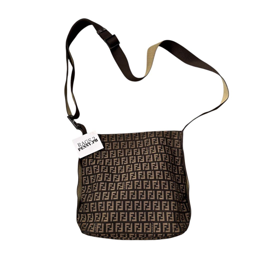 Fendi FF Logo Shoulder Bag (Category: Luxury Bags & Wallets) located in Kabacan. Submitted by rags2penny.phl (Listing ID 1415486450, Image 1). Description: - Fendi shoulder bag - Iconic FF logo pattern - Adjustable brown strap - Top zipper closure - Silver-toned hardware - Interior leather tag with Fendi logo and "Made in Italy" issue : chips on leather (see 5th - 7th photo).