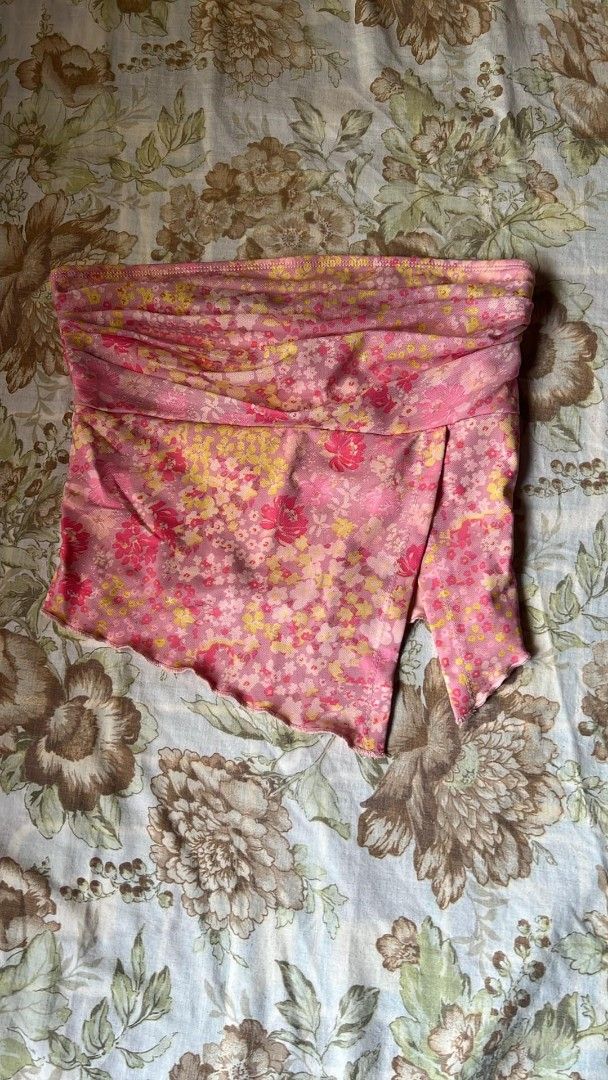 Floral Tube Top (Category: Sleeveless) located in Manila. Submitted by nicoleanne84656 (Listing ID 1415467295, Image 1). Description: - Vibrant floral print (pink & yellow) - Unique draped front design - Lightweight fabric - Perfect for warm weather - Dress up or down style.