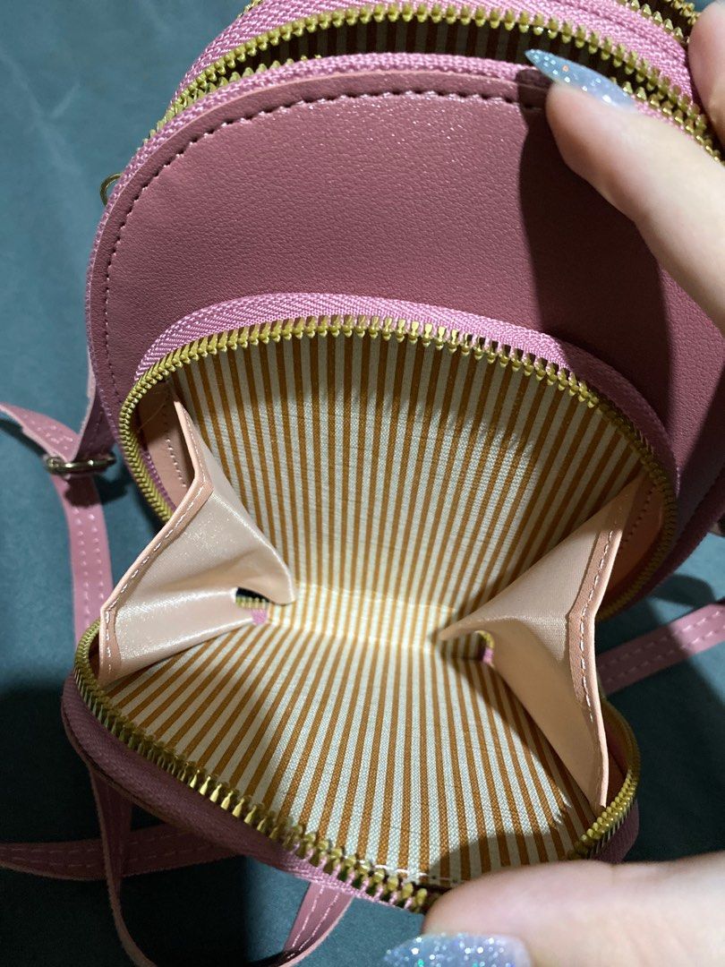 Forever Young Pink Crossbody Bag (Category: Cross-body Bags) located in Manila. Submitted by ctrlfreakk (Listing ID 1415576099, Image 2). Description: - Pink, Leather Bag - Long, adjustable strap - Gold Zipper - Three (3) compartments - With card holder - Can fit 6 inch phone MOP: Gcash (Preffered) MOD: Lalamove / GGX RFS: Need funds for tuition. Decluttering. LOC: Quezon City Same day delivery. SF to be shouldered by buyer..