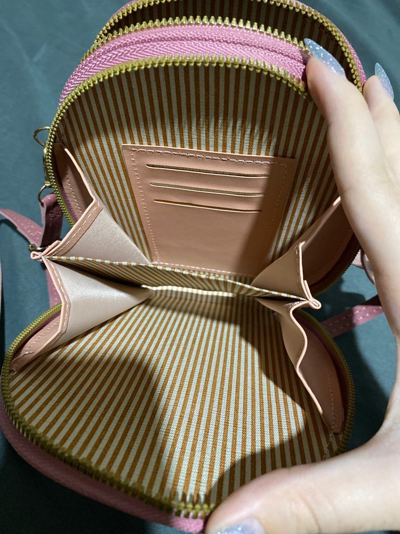 Forever Young Pink Crossbody Bag (Category: Cross-body Bags) located in Manila. Submitted by ctrlfreakk (Listing ID 1415576099, Image 3). Description: - Pink, Leather Bag - Long, adjustable strap - Gold Zipper - Three (3) compartments - With card holder - Can fit 6 inch phone MOP: Gcash (Preffered) MOD: Lalamove / GGX RFS: Need funds for tuition. Decluttering. LOC: Quezon City Same day delivery. SF to be shouldered by buyer..