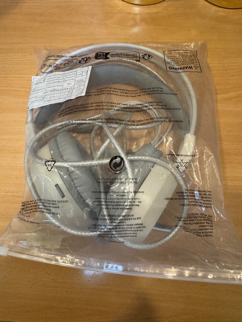 Gaming Headset with Microphone (Category: Headphones & Headsets) located in Quezon City. Submitted by things.matter (Listing ID 1415448985, Image 2). Description: Gaming headset with a built-in microphone. It has a white and gray color scheme. The headset has a USB connector and two 3.5mm audio jacks. The earcups are padded for comfort. The microphone is flexible and can be adjusted..