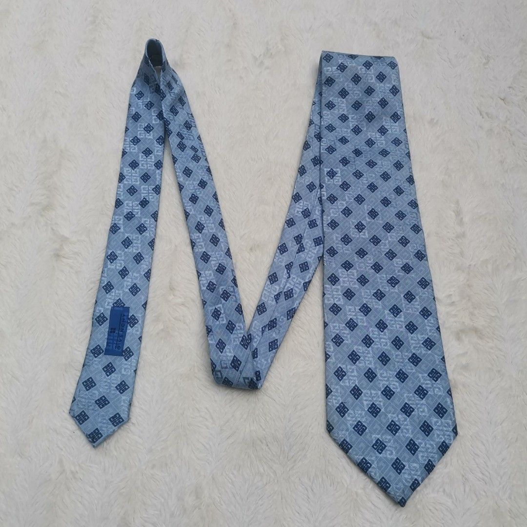 Givenchy Silk Tie (Category: Ties) located in Manila. Submitted by titojay (Listing ID 1415456416, Image 3). Description: - Givenchy tie - Light blue color - Geometric pattern - Made of silk - Classic shape - Ideal for formal occasions.