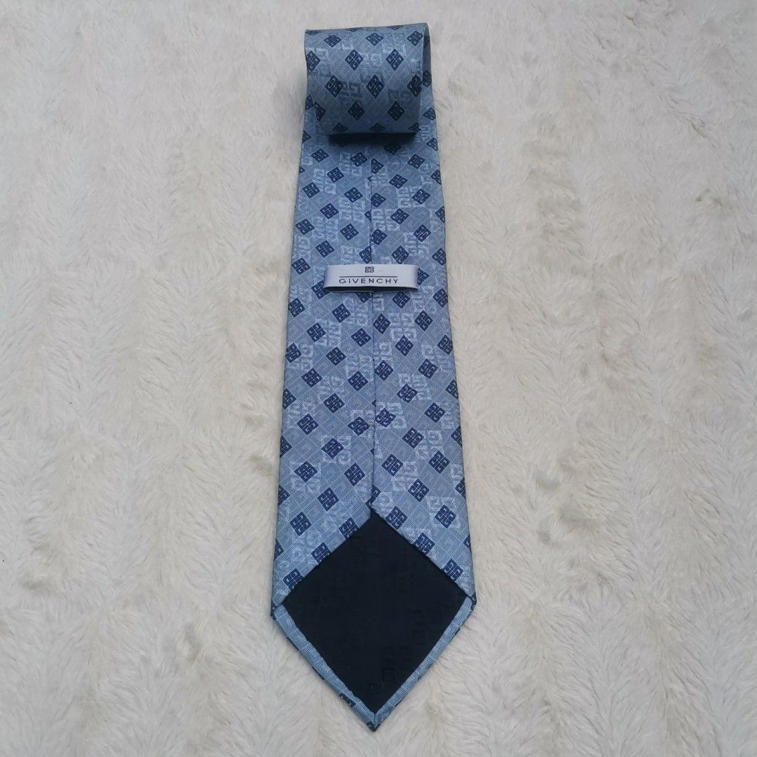 Givenchy Silk Tie (Category: Ties) located in Manila. Submitted by titojay (Listing ID 1415456416, Image 2). Description: - Givenchy tie - Light blue color - Geometric pattern - Made of silk - Classic shape - Ideal for formal occasions.