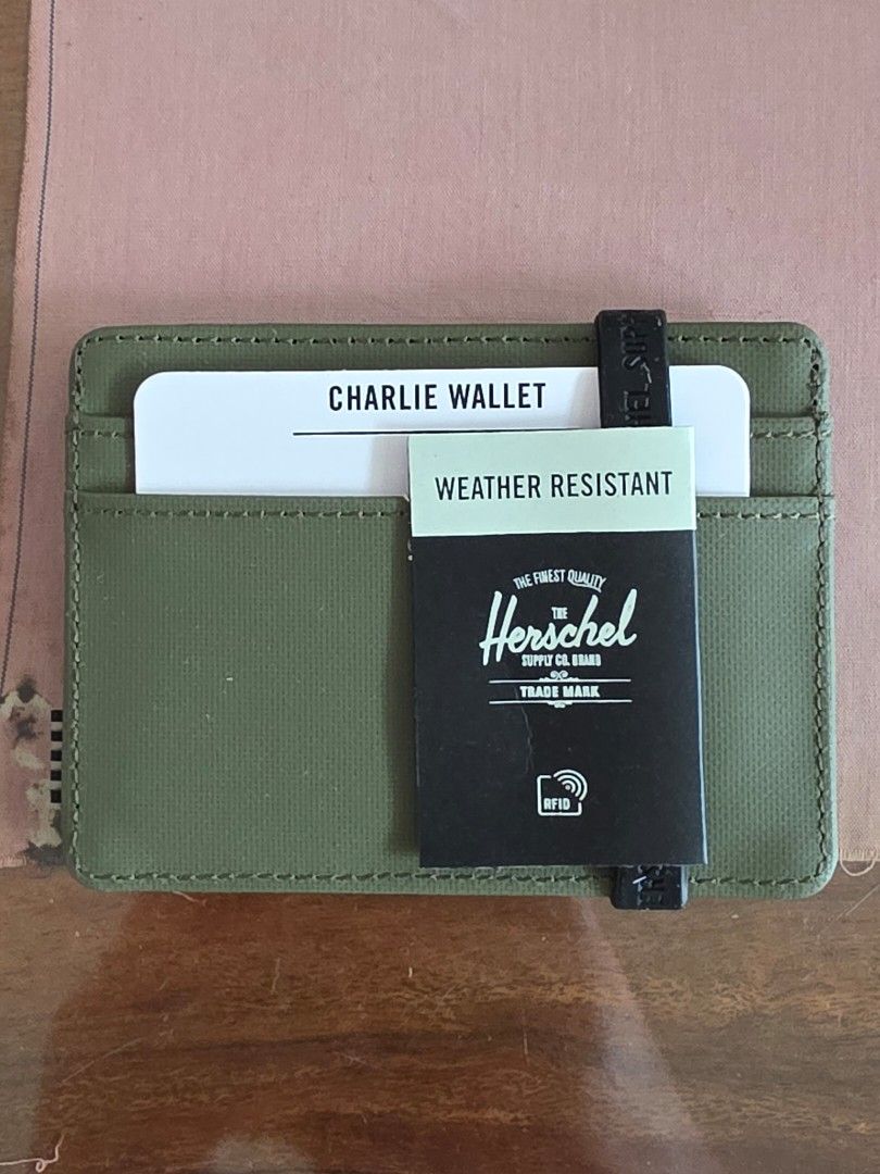 Herschel Logo Card Slot (Category: Wallets & Card Holders) located in San Juan City. Submitted by mia.concep (Listing ID 1415599144, Image 2). Description: The Herschel Supply Co. logo card slot features four exterior card slots and an open-top design for easy access. - Exterior: Four card slots - Open top - 100% polyethylene terephthalate - Lining: 100% polyester - Spot clean SIZE 4"W x 3"H.