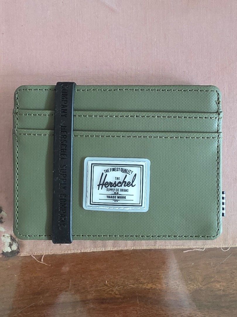 Herschel Logo Card Slot (Category: Wallets & Card Holders) located in San Juan City. Submitted by mia.concep (Listing ID 1415599144, Image 1). Description: The Herschel Supply Co. logo card slot features four exterior card slots and an open-top design for easy access. - Exterior: Four card slots - Open top - 100% polyethylene terephthalate - Lining: 100% polyester - Spot clean SIZE 4"W x 3"H.