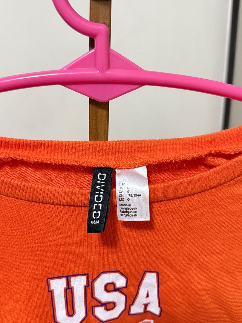 H&M Divided Louisiana Sweatshirt (Category: Longsleeves) located in Manila. Submitted by preluvsbyzee (Listing ID 1415603282, Image 2). Description: - H&M Divided orange sweatshirt - Size: L - Crew neck - Long sleeves .