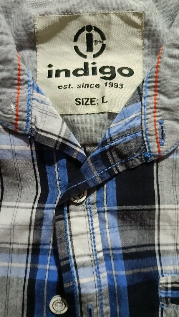 Indigo Plaid Shirt - Size L (Category: Tshirts & Polo Shirts ) located in General Trias. Submitted by ecsandt (Listing ID 1415496542, Image 3). Description: + Indigo polo + Size: L + Button-down closure + Features: Chest pocket, sleeve patch + Color: Blue, black, and white plaid + Brand: Indigo (Est. 1993).